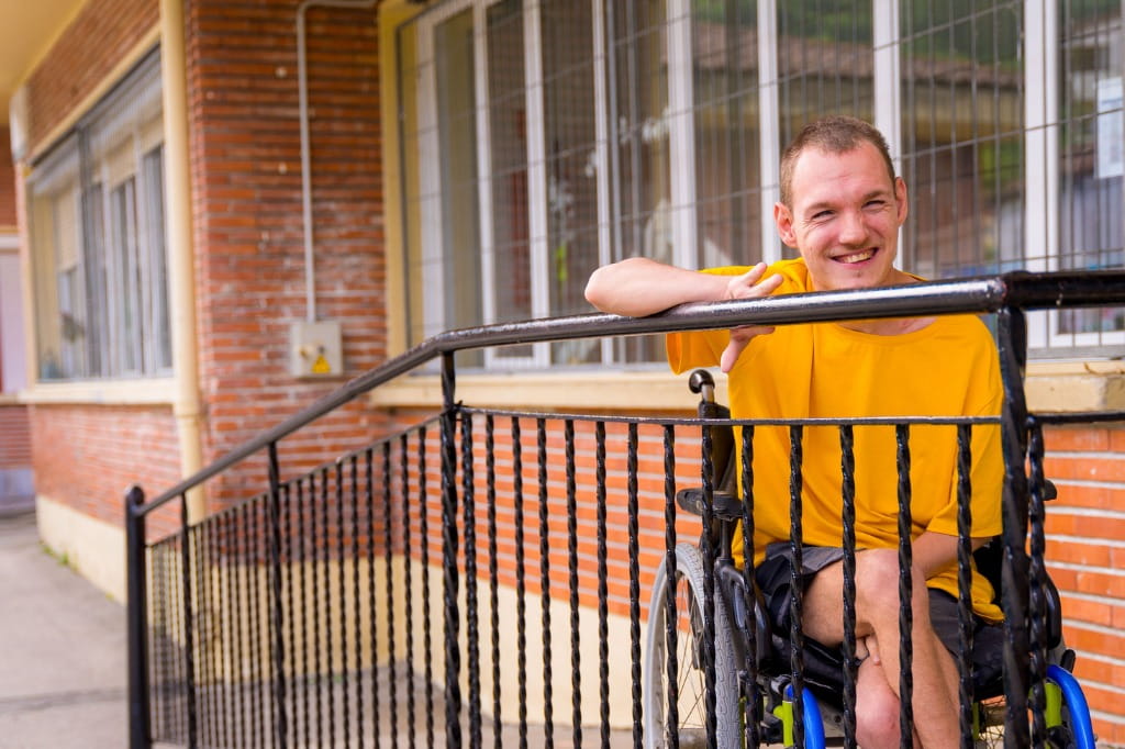 disabled-person-dressed-in-yellow-in-a-wheelchair