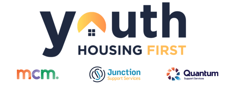 Logo for 'Youth Housing First,' with the letter 'o' in 'youth' stylised as a house with a yellow roof and small window. Below, 'HOUSING' is in dark blue and 'FIRST' is in orange. Below the main text are three logos: 'mcm.' in a multicolored, lowercase font; 'Junction Support Services' with a circular blue icon; and 'Quantum Support Services' with a circular design in shades of orange and blue.